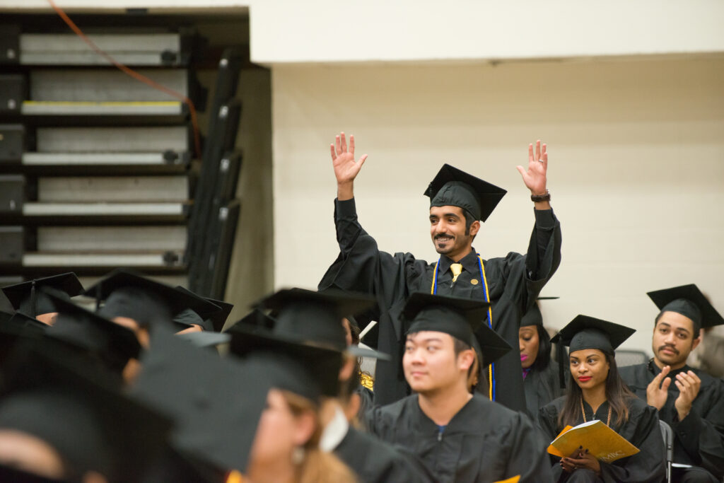 Muntadar Al-Luwaim '15, design, is recognized by Pres. Hrabowski during Undergraduate Commencement