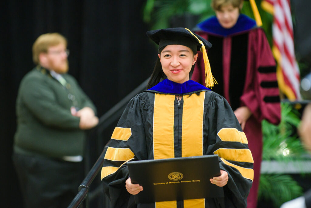 Jing Xu receives a Ph.D. in gerontology.