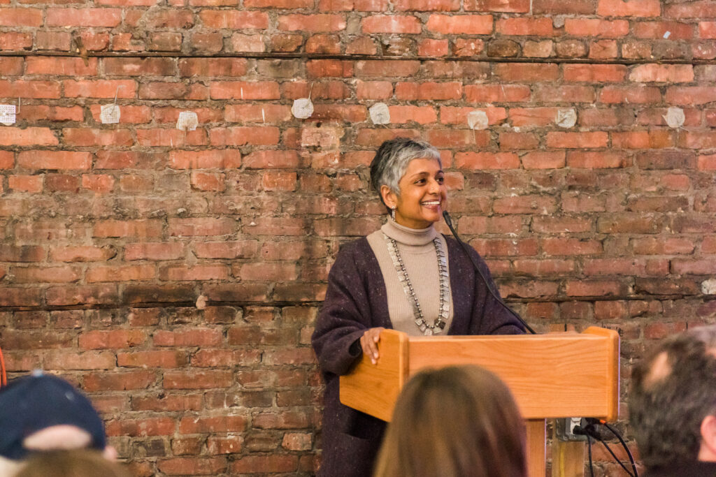 Preminda Jacob, chair and associate professor of visual arts, speaks at the SPARK gallery.