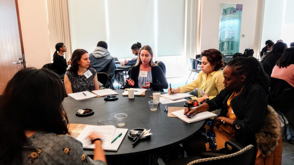 Public policy professionals and students discuss current policy issues in Baltimore City.