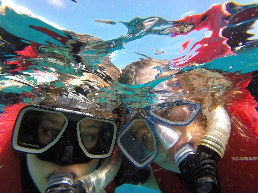 Kempske (right) snorkling with her sister at the Great Barrier Reef in Australia.