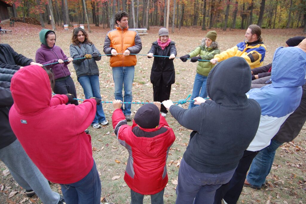 Joby Taylor, Ph.D. '05, language, literacy, and culture, (fourth on the right)director of the Shriver Peaceworker Program at UMBC, with Shriver Peaceworker Fellows participating in a leadership development activity. Photo courtesy of Charlotte Keniston, MFA '14, intermedia and digital art, associate director of the Peaceworker Program.